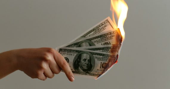 Is burning money illegal?